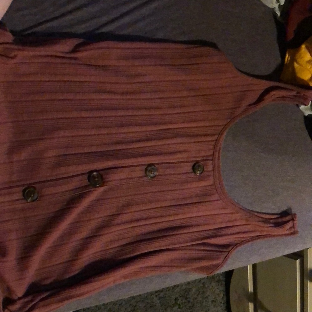 It’s a cute pink button tink top